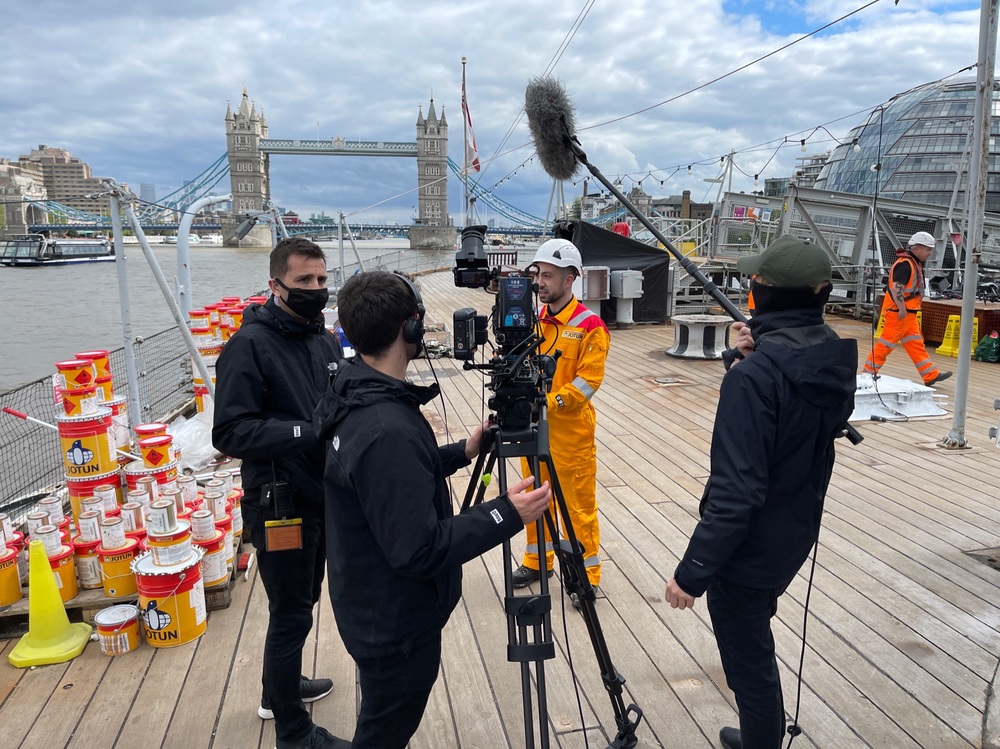 Filming with tower bridge in background